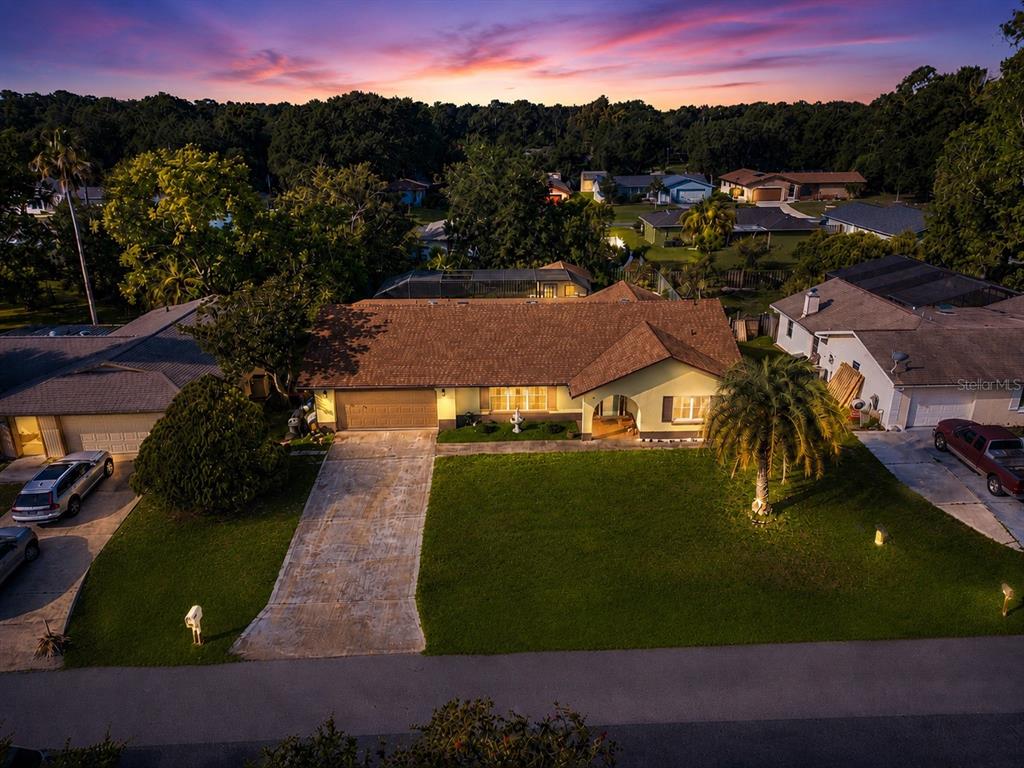 An aerial view of a suburban house with a brown roof and a front lawn — 10 BLACKBURN PLACE, PALM COAST, FL
