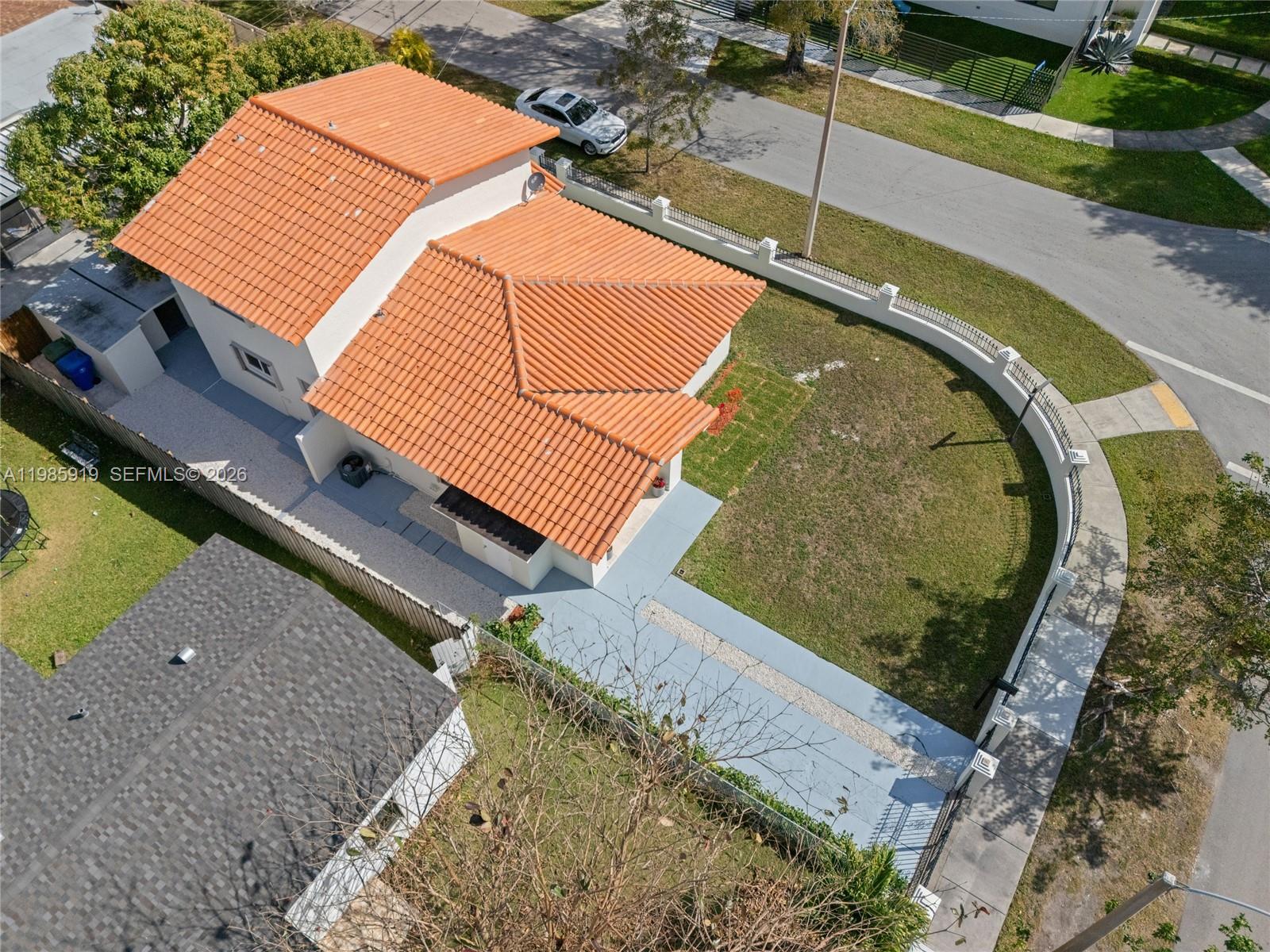 An aerial view shows a house with a terracotta tile roof and a fenced yard — 5251 SW 6th St, Miami FL 33134, MIAMI, FL