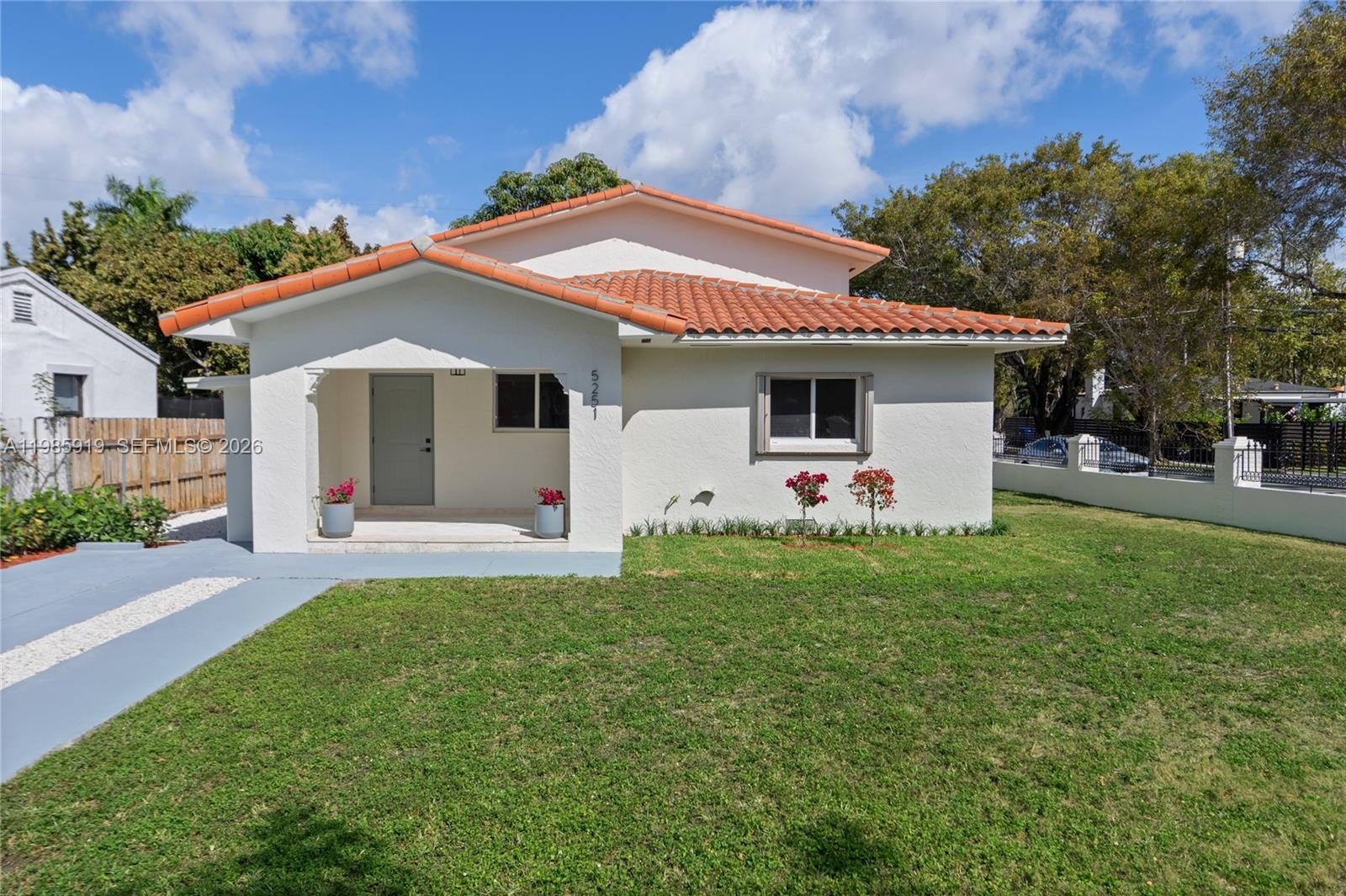 A single-story house with a white exterior, terracotta roof, and a covered front porch — 5251 SW 6th St, Miami FL 33134, MIAMI, FL