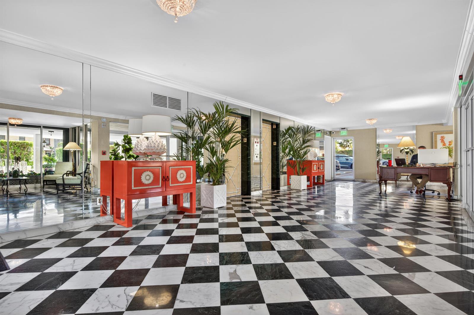 A lobby features a black and white checkered floor, mirrored walls, and an orange cabinet — 227 Australian Avenue # 2c, Palm Beach FL 33480, PALM BEACH, FL