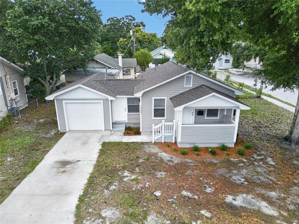 An aerial view of a single-story gray house with a garage and front porch — 1905 24TH STREET S, ST PETERSBURG, FL