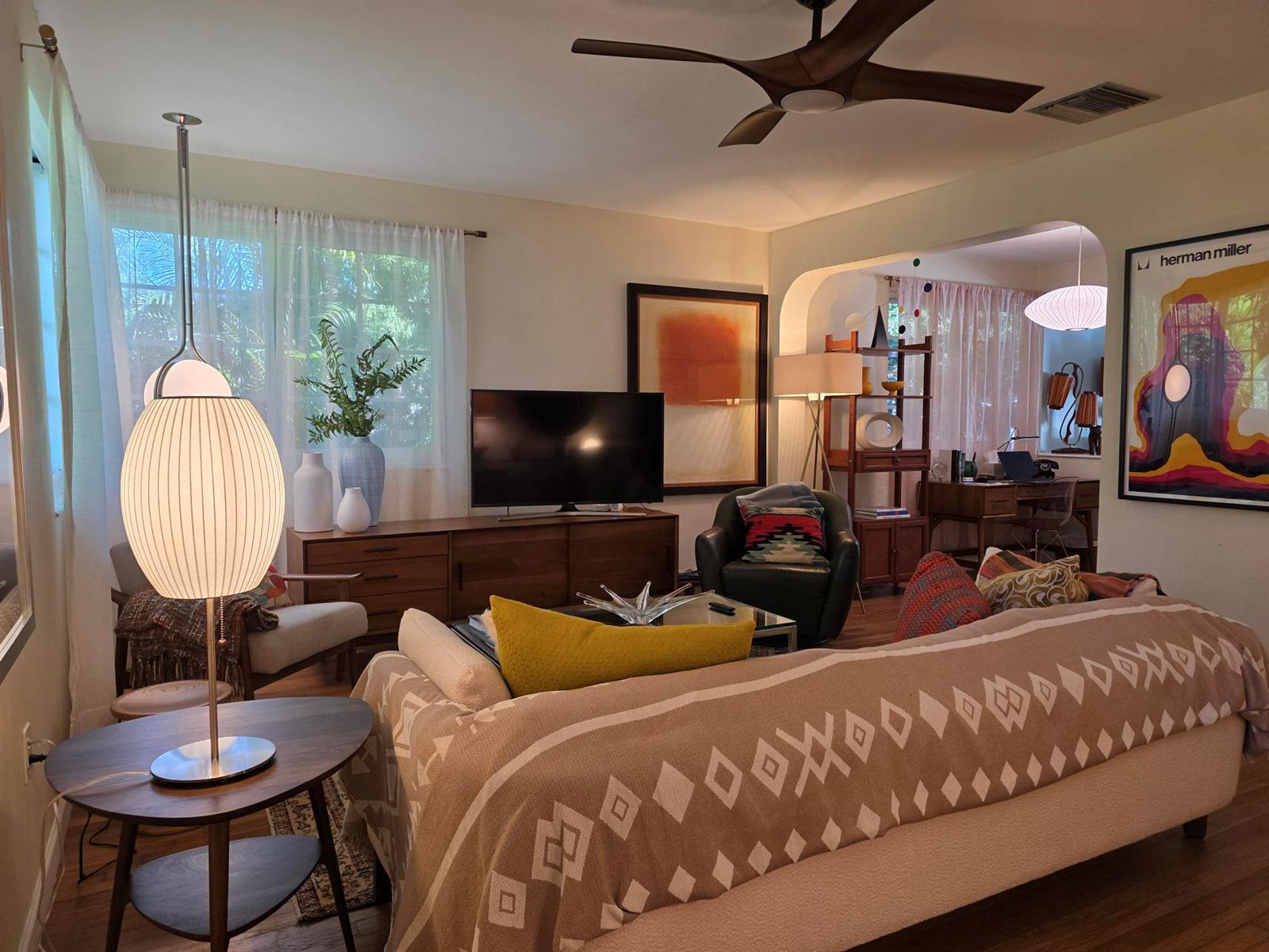 A living room with mid-century modern furniture, a television, a ceiling fan, and a sofa — 1118 N K Street, FL 33460, FL