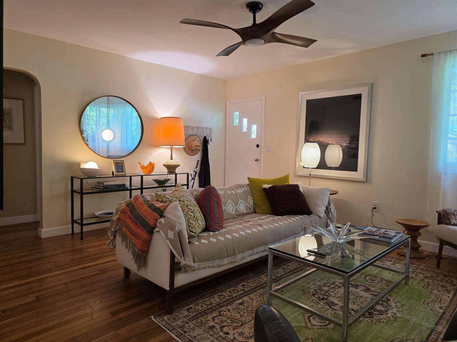 A living room features a sofa, glass coffee table, area rug, and a ceiling fan — 1118 N K Street, FL 33460, FL