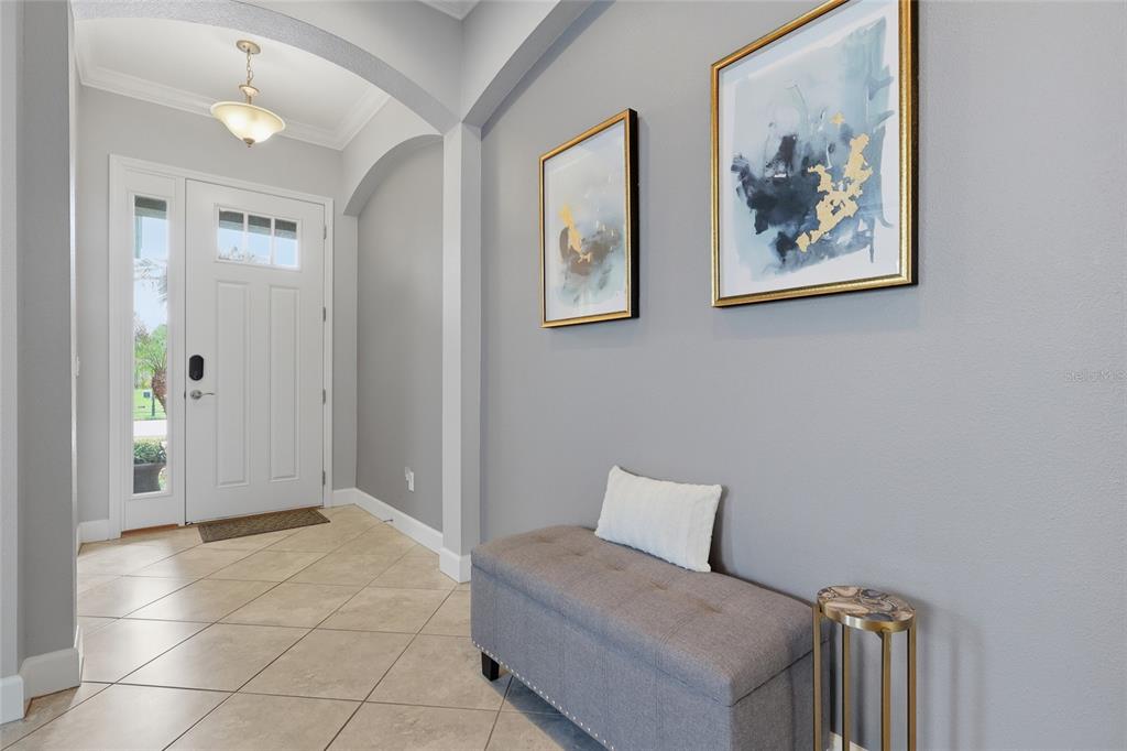 An aerial view of a house with a screened-in pool and patio in the backyard — 27035 CAROLINA ASTER DRIVE, WESLEY CHAPEL, FL