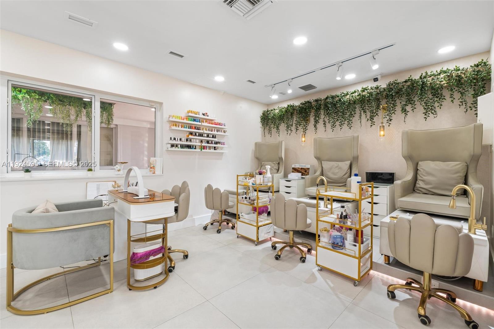 A bright nail salon features three pedicure chairs, a manicure station, and hanging greenery decor — 0000 SW 87th Ave, Miami FL 33165, MIAMI, FL