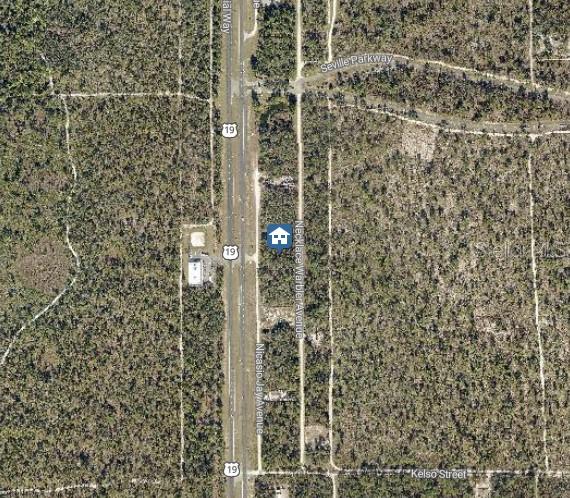 This is an aerial map view showing a vacant lot located near a highway — LOT 14 NECKLACE WARBLER, WEEKI WACHEE, FL