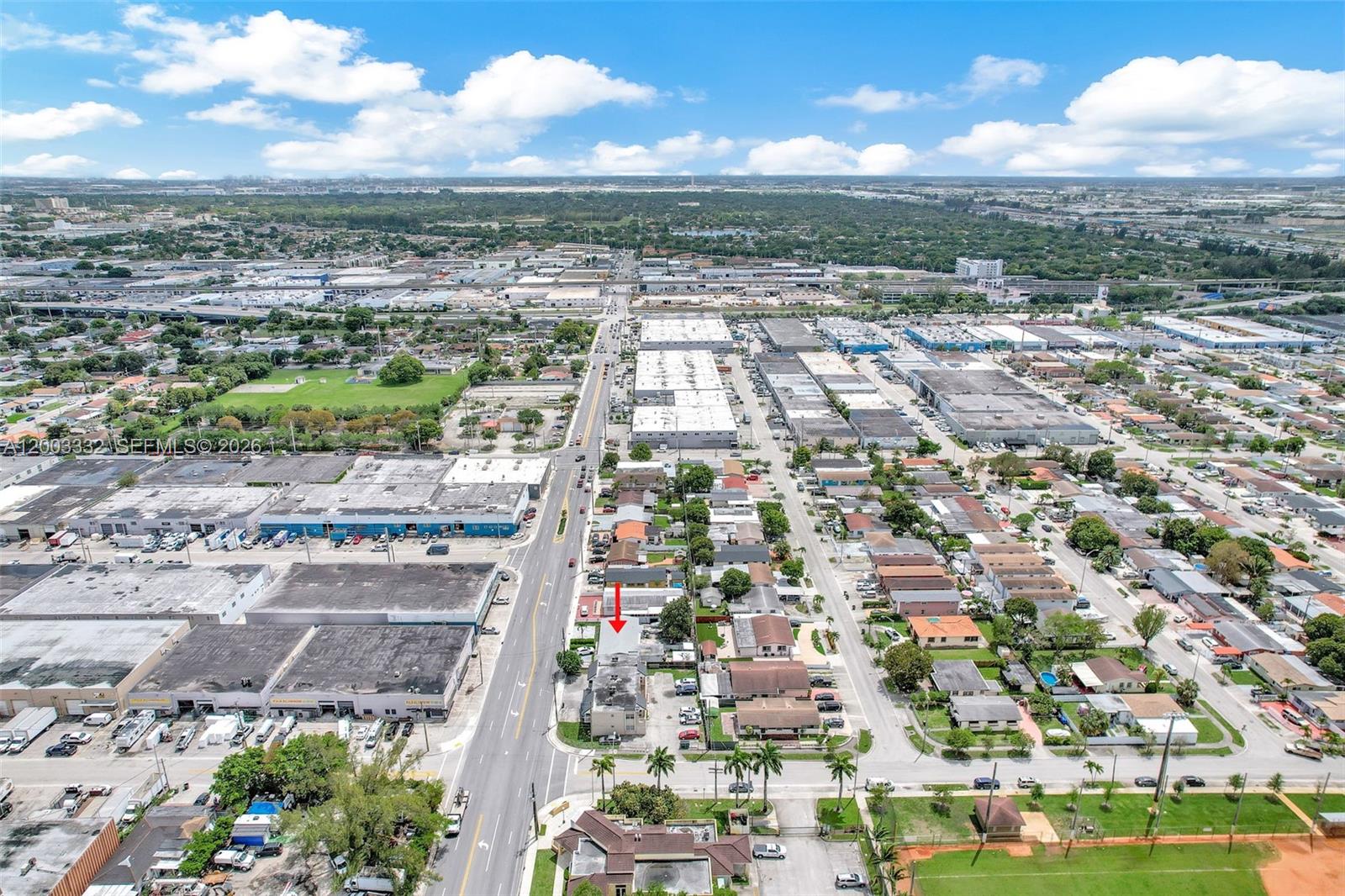 An aerial view shows a commercial building with a red arrow pointing to its roof — 2650 W 8th Ave, Hialeah FL 33010, HIALEAH, FL