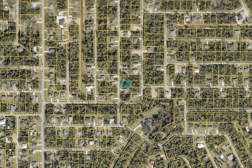 This is an aerial map showing a vacant lot highlighted in a residential neighborhood — LAKEPORT STREET, NORTH PORT, FL