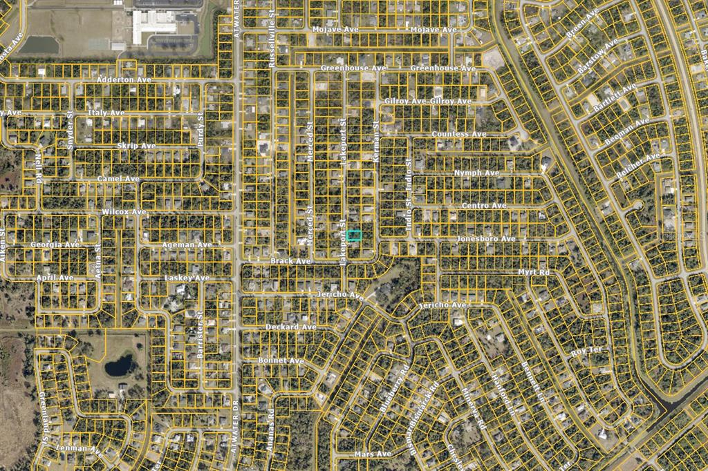 This is an aerial map showing a residential neighborhood with highlighted property boundaries — LAKEPORT STREET, NORTH PORT, FL