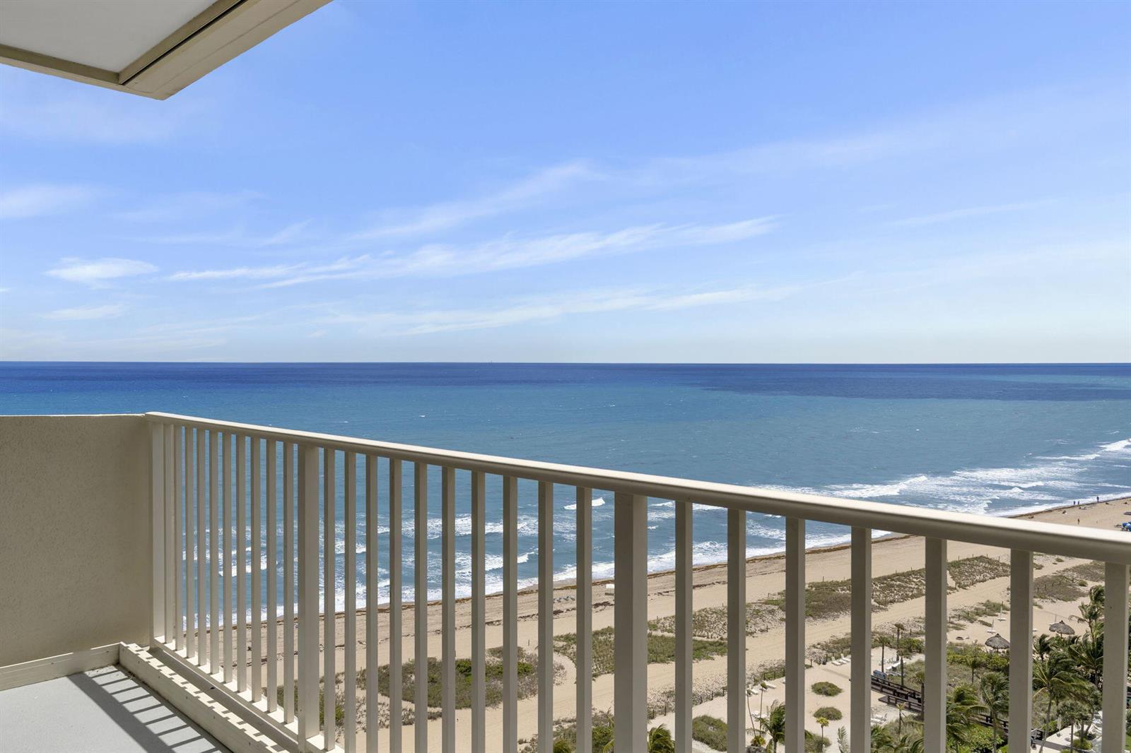 A high-angle view from a balcony overlooking a sandy beach and the ocean — 750 N Ocean Boulevard # 1904, Pompano Beach FL 33062, POMPANO BEACH, FL