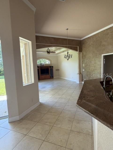 A view from a kitchen counter looking into a living room with tile floors — 857 BOUNDARY BOULEVARD, ROTONDA WEST, FL