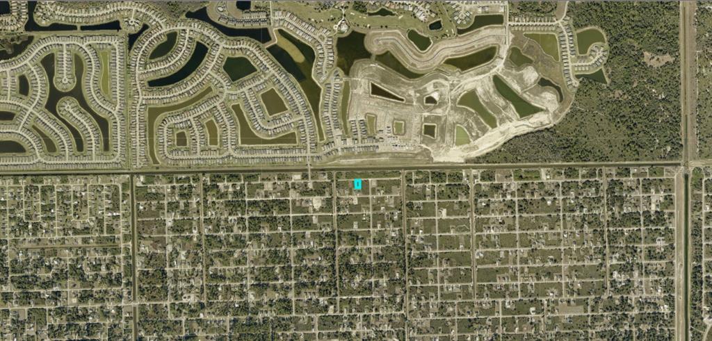 This aerial map shows a residential area with a highlighted plot of land — 3119 75TH STREET W, LEHIGH ACRES, FL