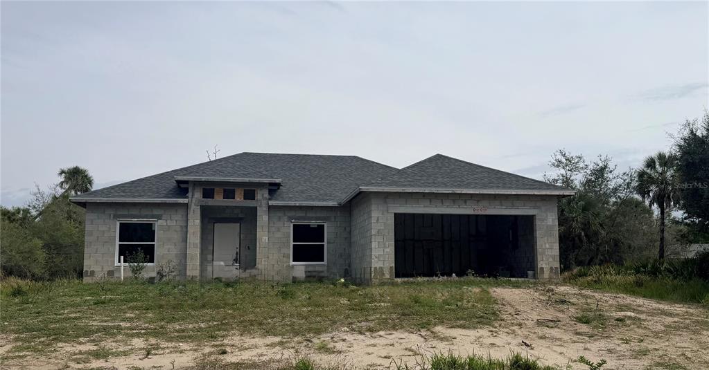 A single-story house under construction with concrete block walls and a shingled roof — 314 BARRETT STREET, PORT CHARLOTTE, FL