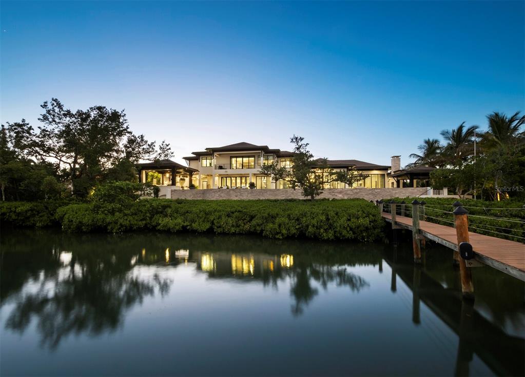 An aerial view of a large waterfront estate with a tiled roof and landscaped grounds — 3799 FLAMINGO AVENUE, SARASOTA, FL