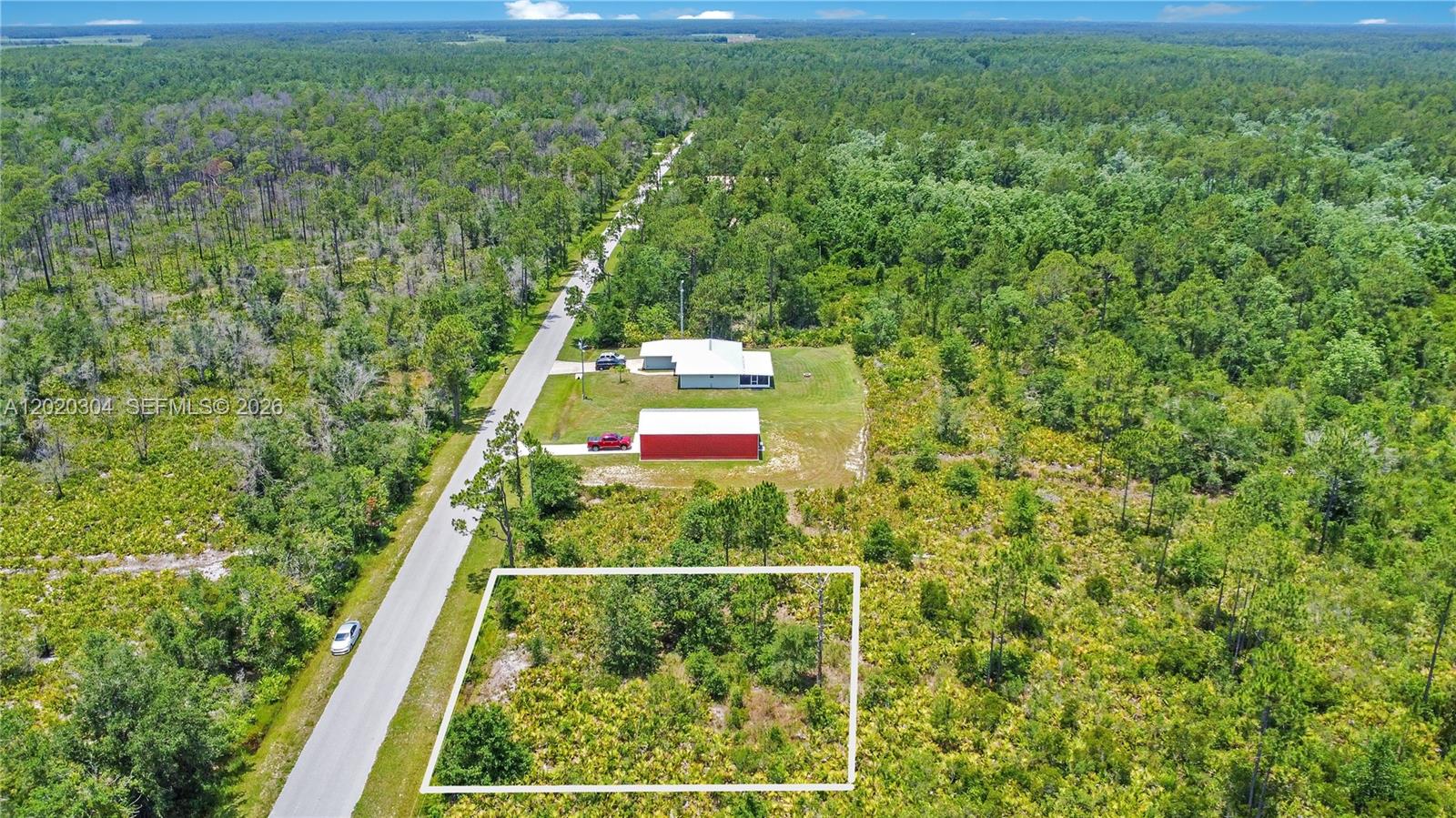 An aerial view shows a rectangular plot of land outlined in white near a road — 4000 Gerona, Sebring FL 33872, SEBRING, FL
