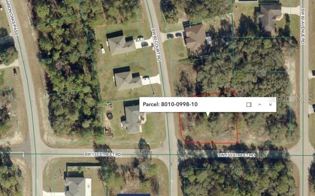 This is an aerial map showing a vacant, wooded residential lot outlined in red — TBD SW 60 COURT ROAD, OCALA, FL