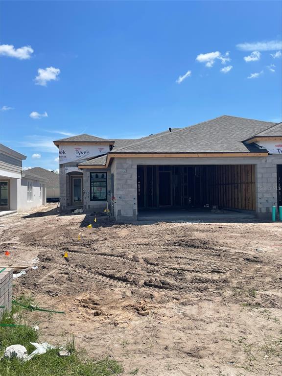 A single-story house under construction with an open garage and exposed concrete block walls — 12365 OAK  HILL WAY, PARRISH, FL
