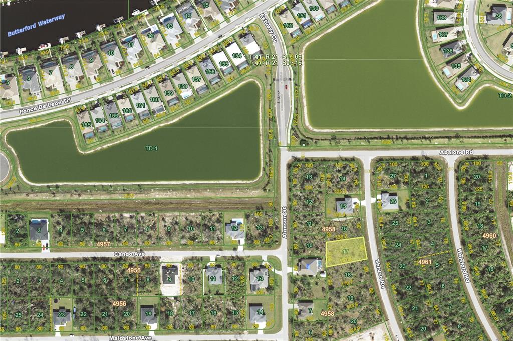 This is an aerial map showing residential lots, streets, and waterways in a suburban neighborhood — 8071 THRUSO ROAD, PORT CHARLOTTE, FL