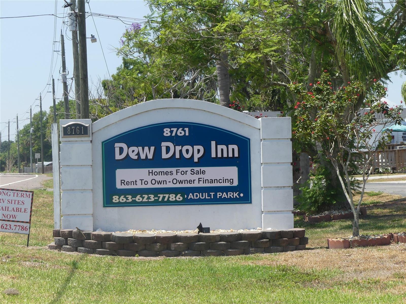 A sign for Dew Drop Inn stands in a grassy area with trees behind it — 8791 Highway 78, Okeechobee FL 34971, OKEECHOBEE, FL
