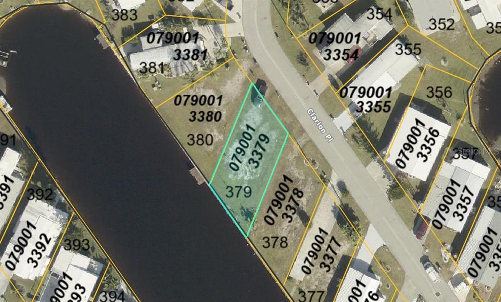 This is an aerial map showing a highlighted vacant lot bordering a canal — 506 CLARION PLACE, NORTH PORT, FL