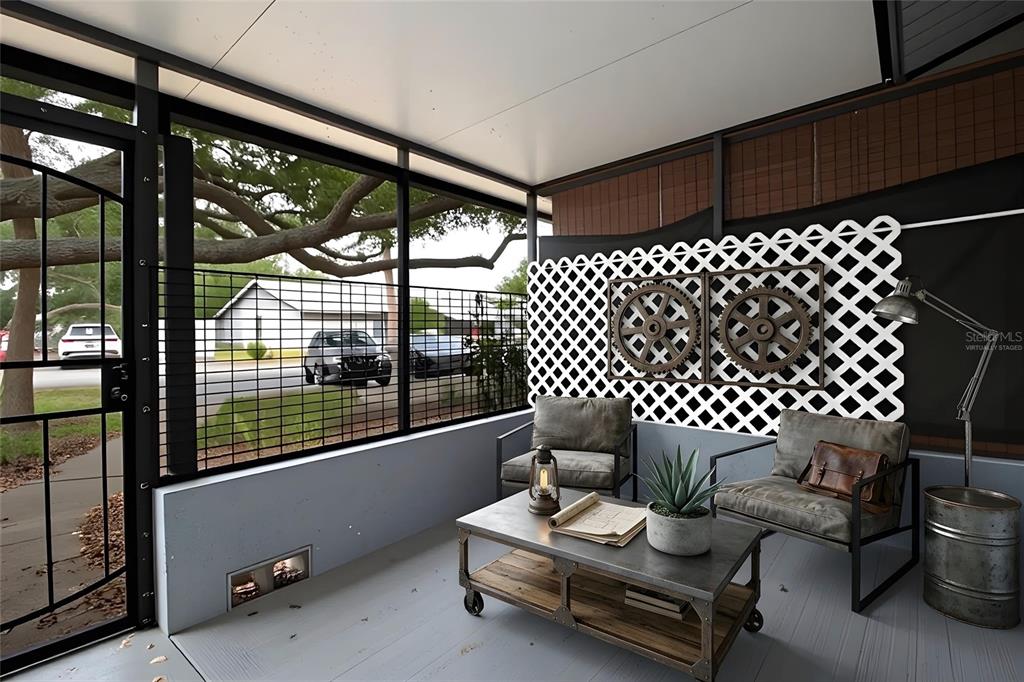This is a virtually staged, screened-in porch with industrial-style furniture and a lattice wall feature — 7115 PARKSIDE VILLAS DR N, ST PETERSBURG, FL