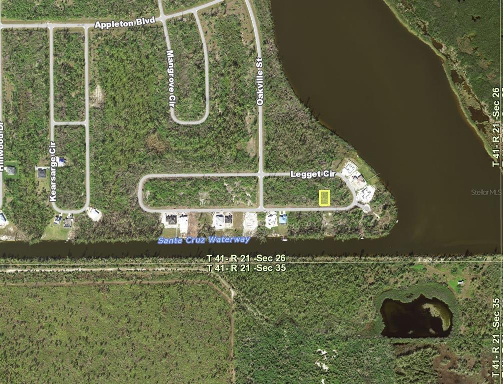 This is an aerial map showing a vacant lot highlighted in yellow along Legget Circle — 16573 LIGGETT CIRCLE, PORT CHARLOTTE, FL