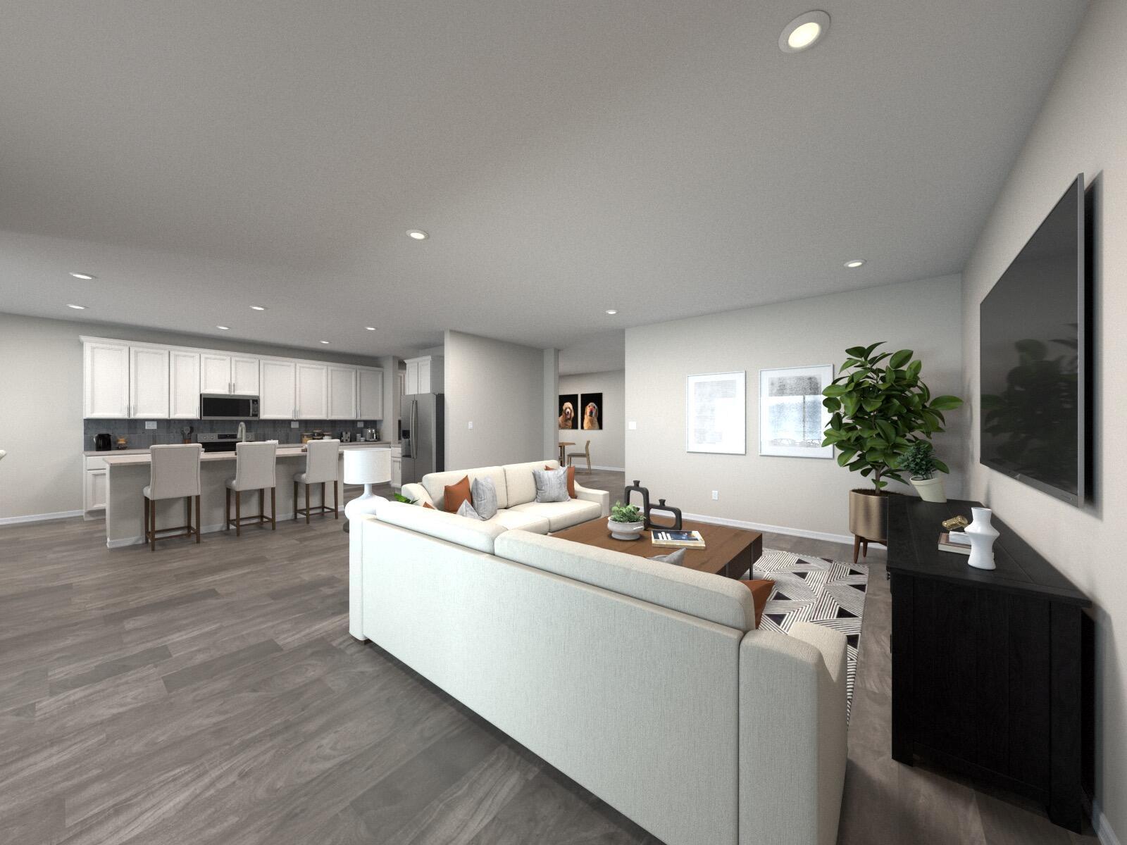 This is a rendering of an open-concept living room and kitchen with light-colored flooring — 5605 Hampton Park Circle, Vero Beach FL 32966, VERO BEACH, FL