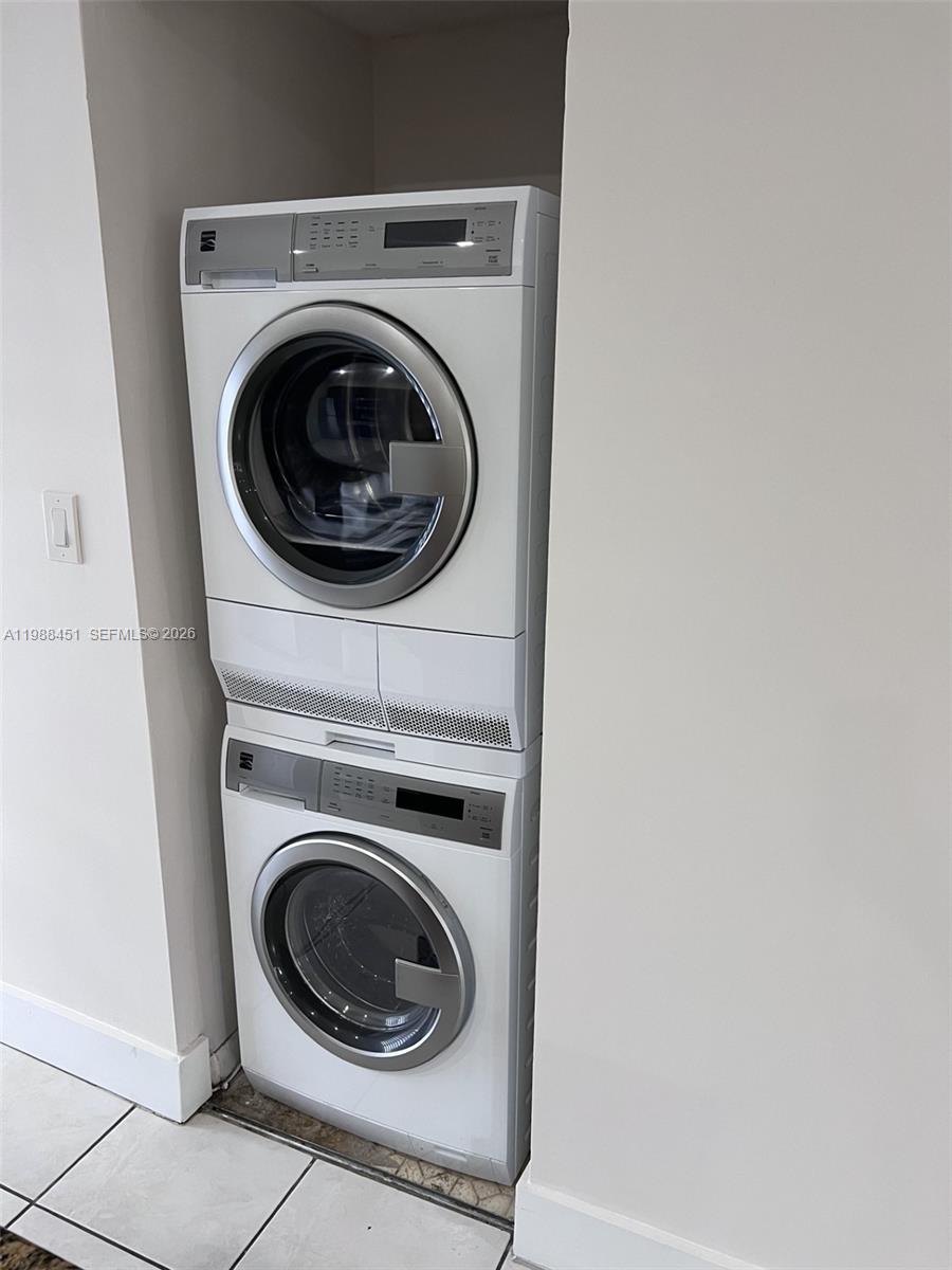 A stacked washer and dryer unit is installed in a recessed wall alcove — 5480 W 21st Ct # 404, Hialeah FL 33016, HIALEAH, FL