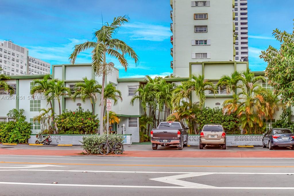 A low-rise apartment building with palm trees and parked cars in front — 1346 Alton Rd # B2, Miami Beach FL 33139, MIAMI BEACH, FL
