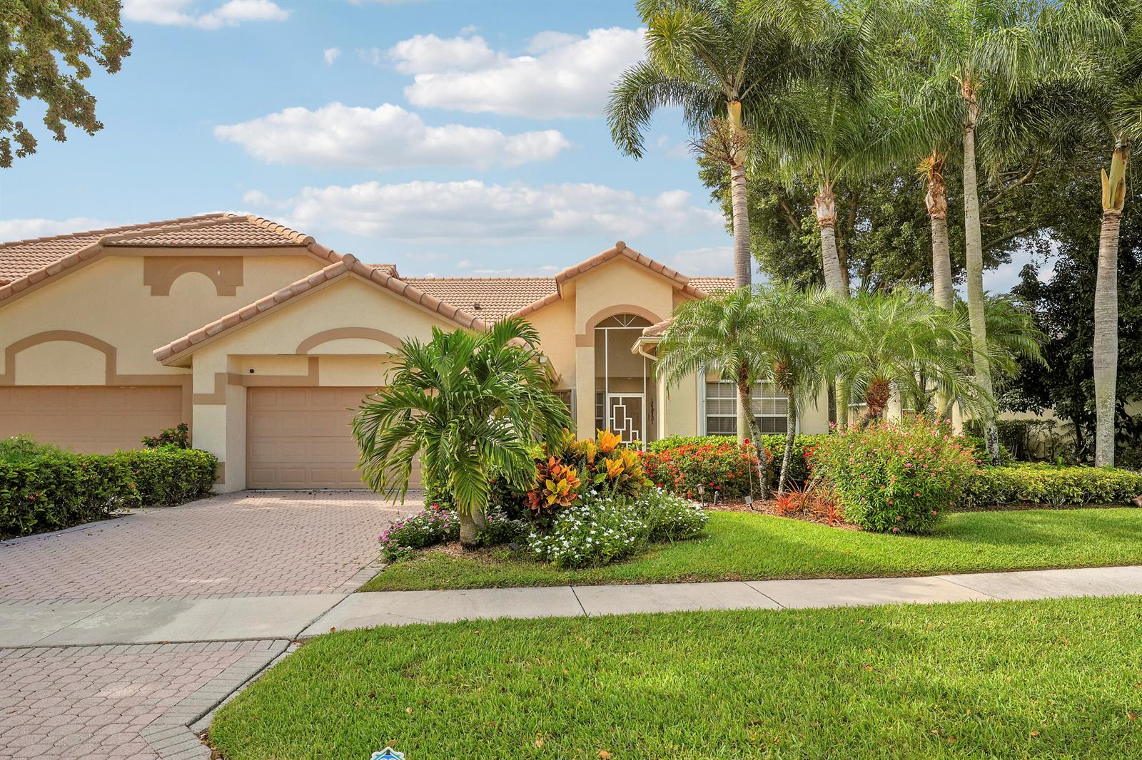 A single-story house with a tile roof, two-car garage, and landscaped front yard — 7136 Ashford Lane, Boynton Beach FL 33472, BOYNTON BEACH, FL