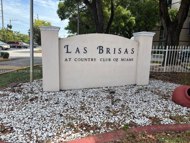 A beige monument sign for Las Brisas at Country Club of Miami sits on gravel — 7075 NW 186th St # C507, Hialeah FL 33015, HIALEAH, FL