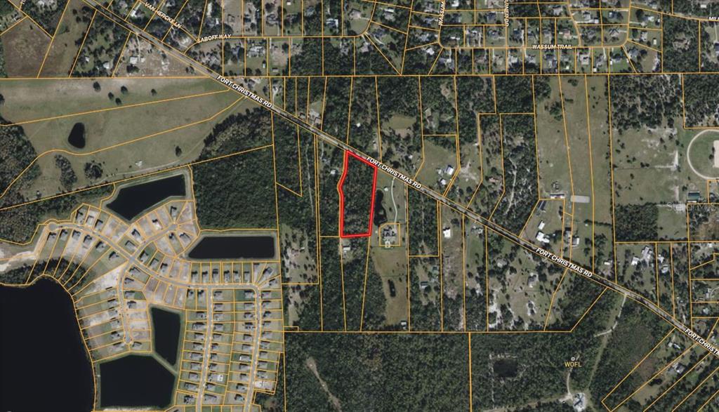 An aerial map shows a rectangular parcel of land outlined in red along a road — 4812 N FORT CHRISTMAS ROAD, CHRISTMAS, FL