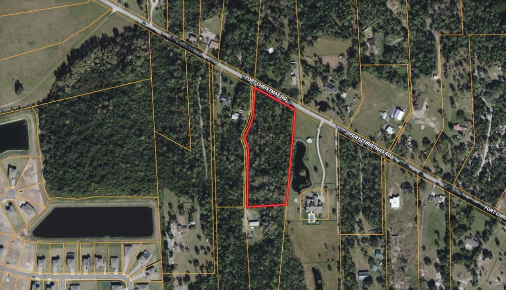 This aerial map shows a wooded parcel of land outlined in red along a road — 4812 N FORT CHRISTMAS ROAD, CHRISTMAS, FL