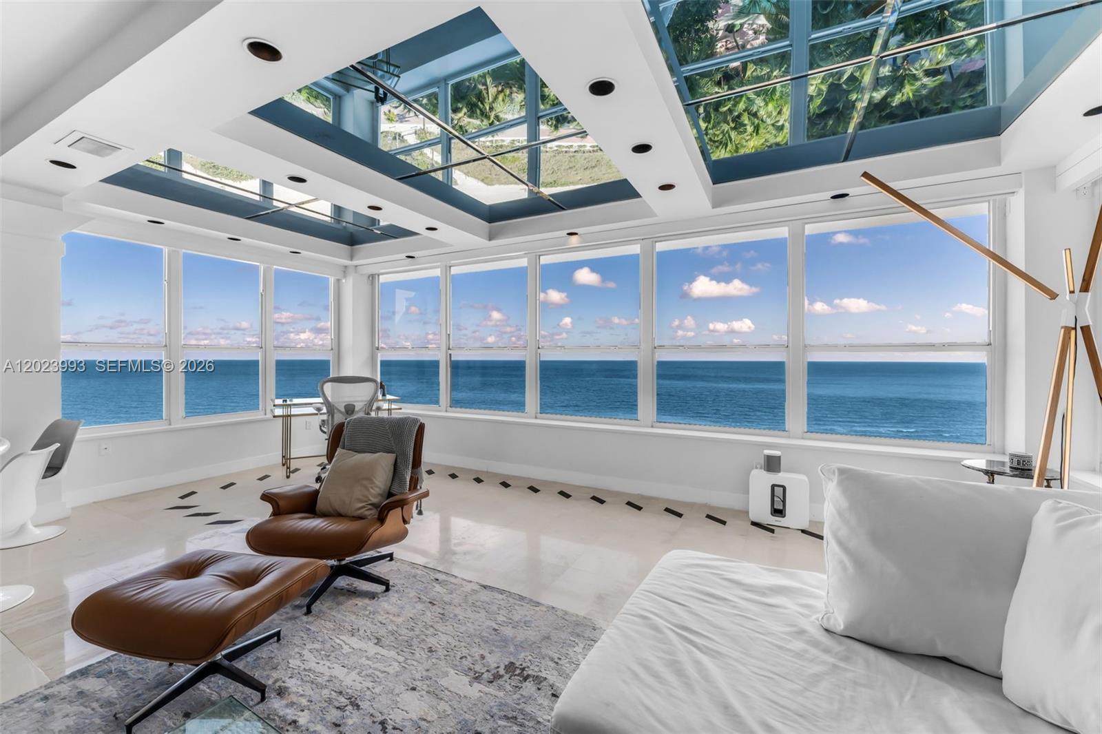 A sunroom with a glass ceiling, floor-to-ceiling windows, and an expansive ocean view — 4925 Collins Ave # 11E, Miami Beach FL 33140, MIAMI BEACH, FL