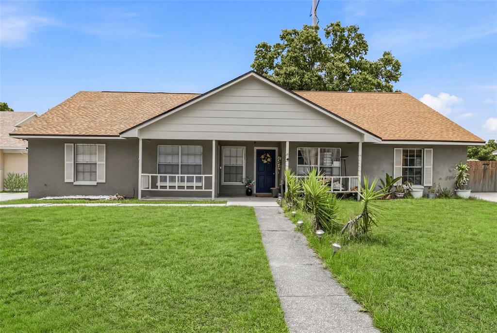 A single-story house with a gray exterior, a covered front porch, and a tan roof — 3257 LAUREL DALE DRIVE, TAMPA, FL