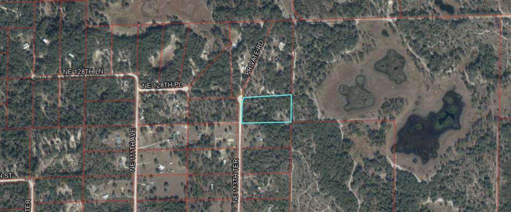 This is an aerial map showing a vacant rectangular lot outlined in blue — 12791 NE 113TH TERRACE, ARCHER, FL