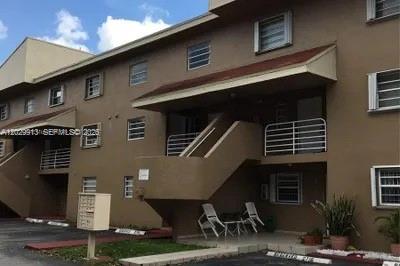 A multi-story brown apartment building exterior with an outdoor staircase and a mailbox stand — 2778 W 60th St # 45, Hialeah FL 33016, HIALEAH, FL