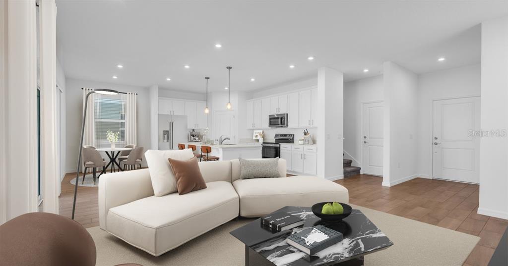 This is a digital rendering of an open-concept living room and kitchen with white cabinetry — 4437 RIVER BEACON BOULEVARD, DAVENPORT, FL