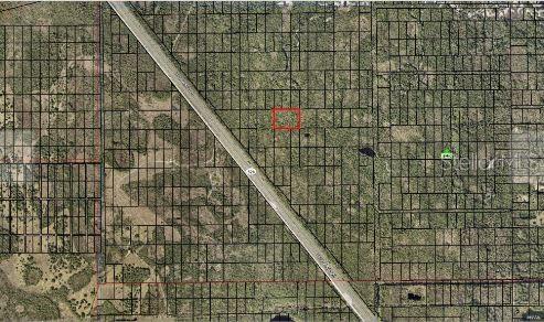 An aerial map view shows a rectangular property lot outlined in red near a highway — CAPE CANAVERAL, PALM BAY, FL
