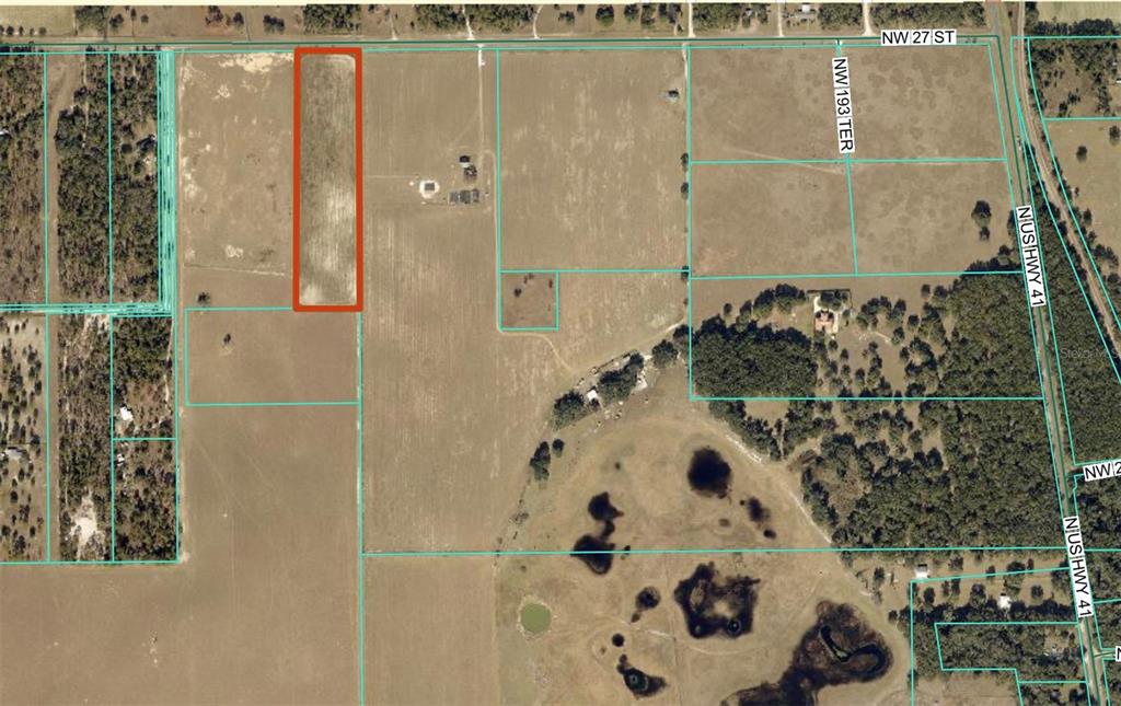 This is an aerial map showing a rectangular parcel of land outlined in red — TBD NW 27TH STREET, MORRISTON, FL