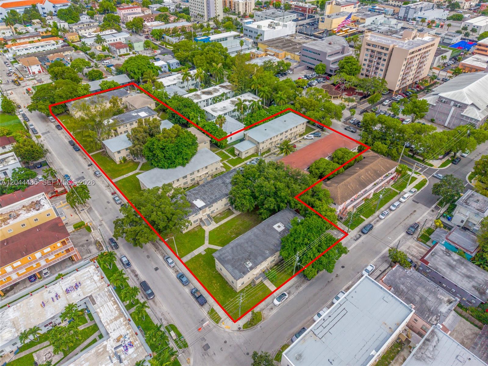 Aerial view of a multi-building apartment complex outlined in red on a city block — 931 SW 3rd St, Miami FL 33130, MIAMI, FL