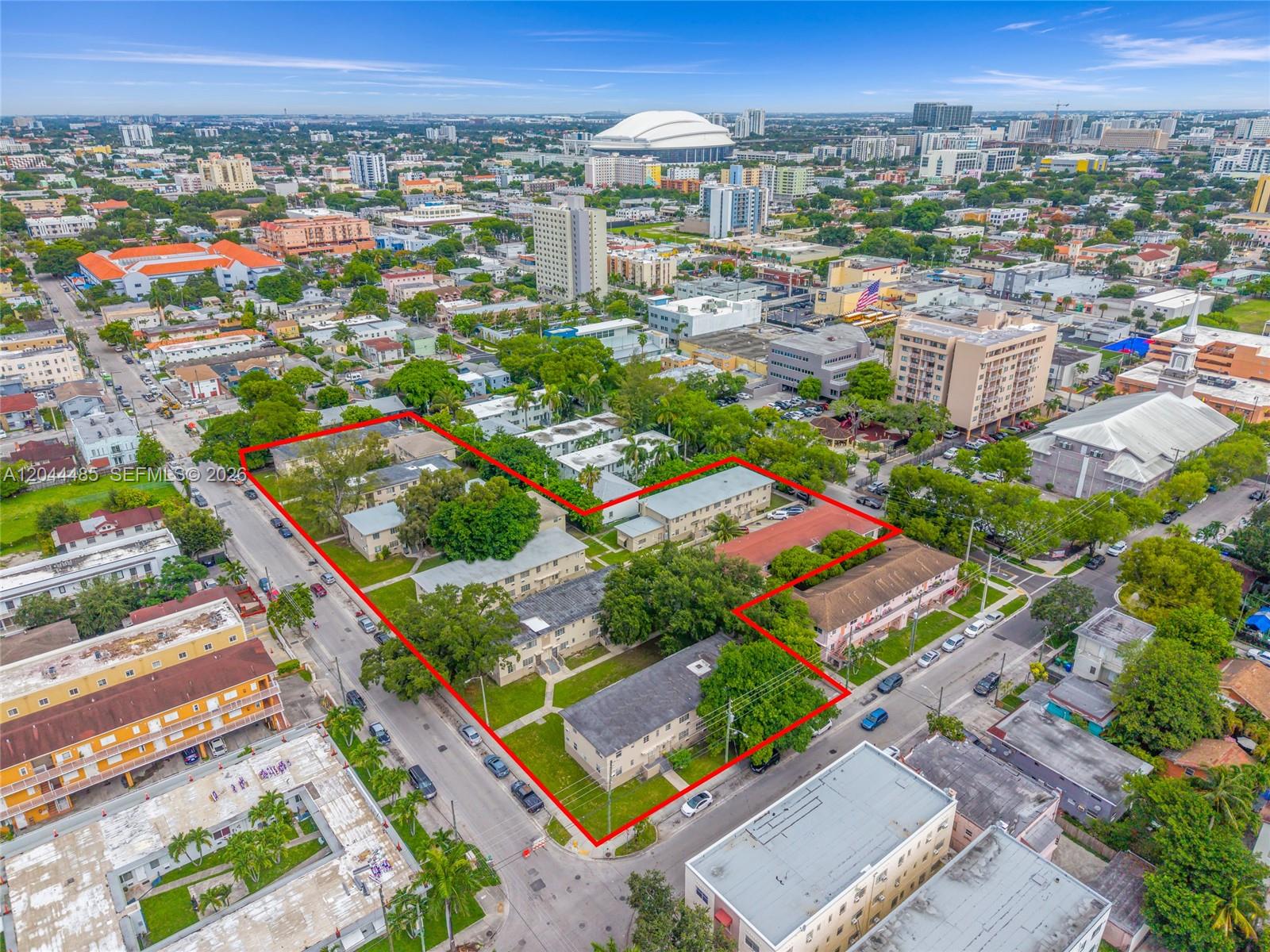 An aerial view shows a multi-building apartment complex outlined in red within a city — 931 SW 3rd St, Miami FL 33130, MIAMI, FL