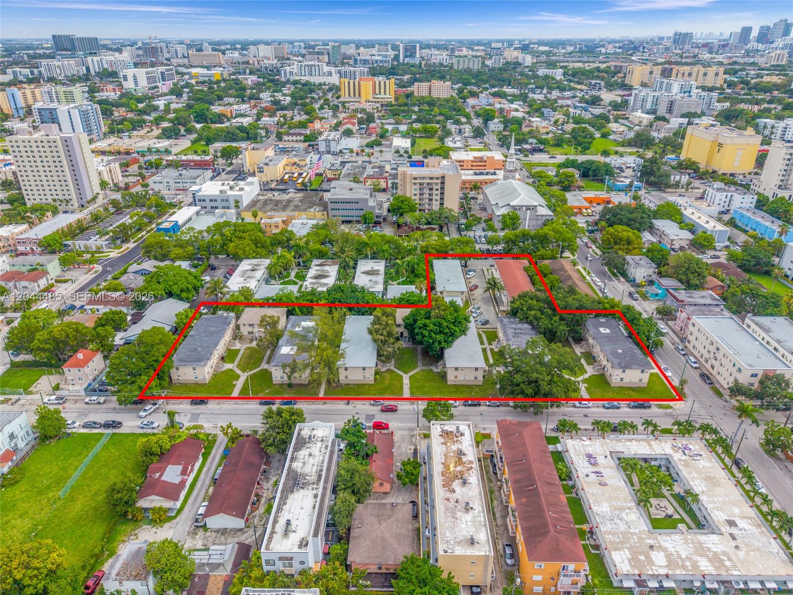 An aerial view shows a multi-building apartment complex outlined in red within a city — 931 SW 3rd St, Miami FL 33130, MIAMI, FL