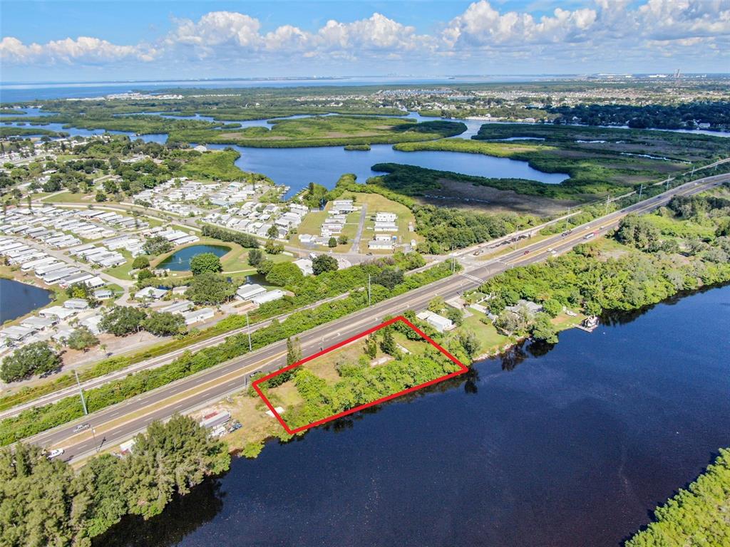 An aerial view shows a rectangular plot of land outlined in red beside a road — 2508 S US HIGHWAY 41, RUSKIN, FL