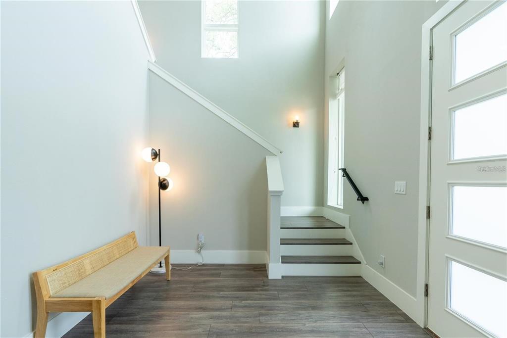 A modern two-story house with a blue front door and a covered porch — 200 E GRANT STREET, ORLANDO, FL