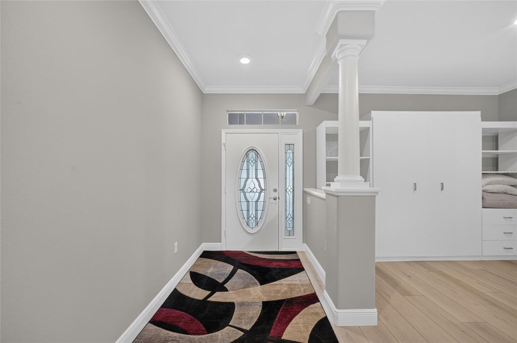 A single-story house with a paved driveway, two garage doors, and mature landscaping — 8640 SW 86TH CIRCLE, OCALA, FL