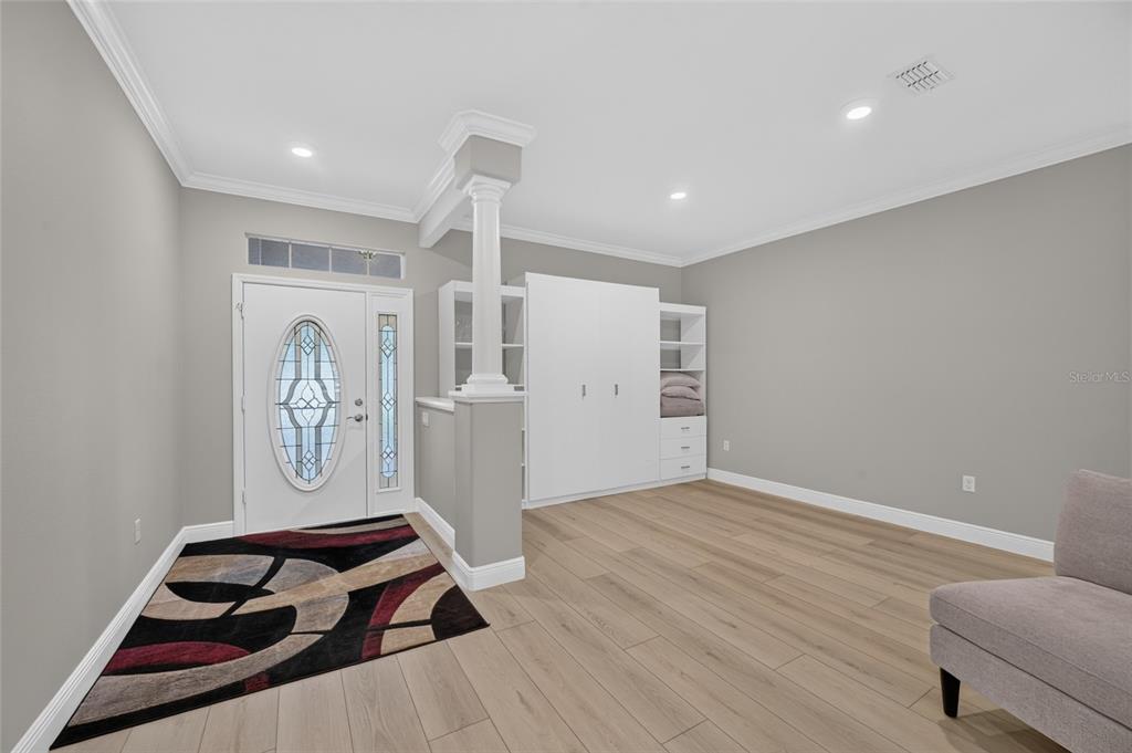 A single-story house with a paved driveway, two garage doors, and mature landscaping — 8640 SW 86TH CIRCLE, OCALA, FL