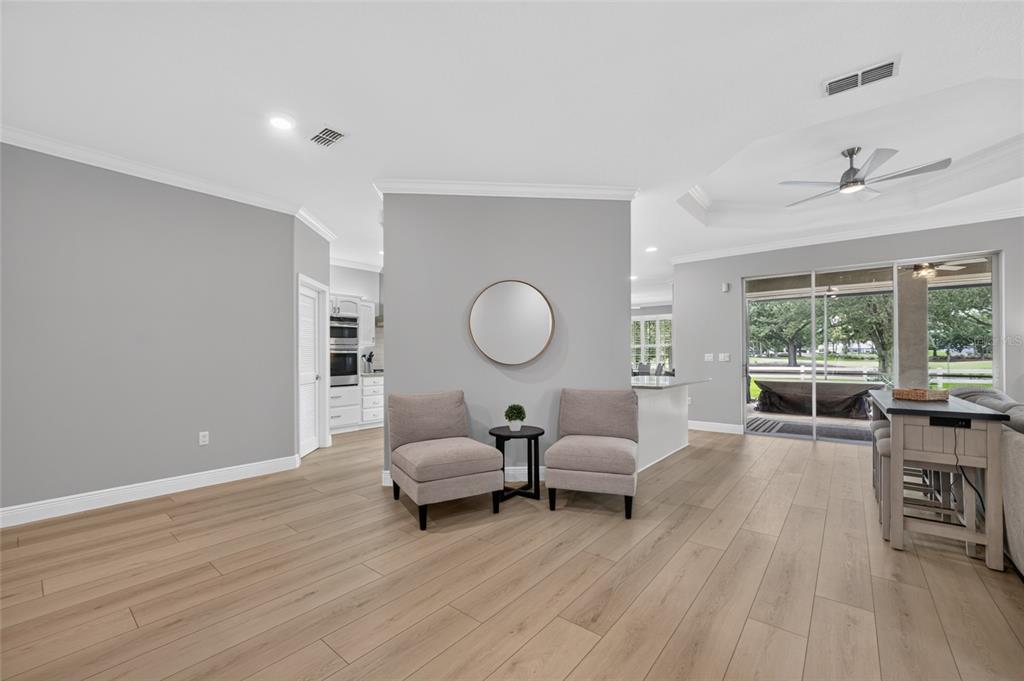 A single-story house with a two-car garage, large shade trees, and landscaped front yard — 8640 SW 86TH CIRCLE, OCALA, FL