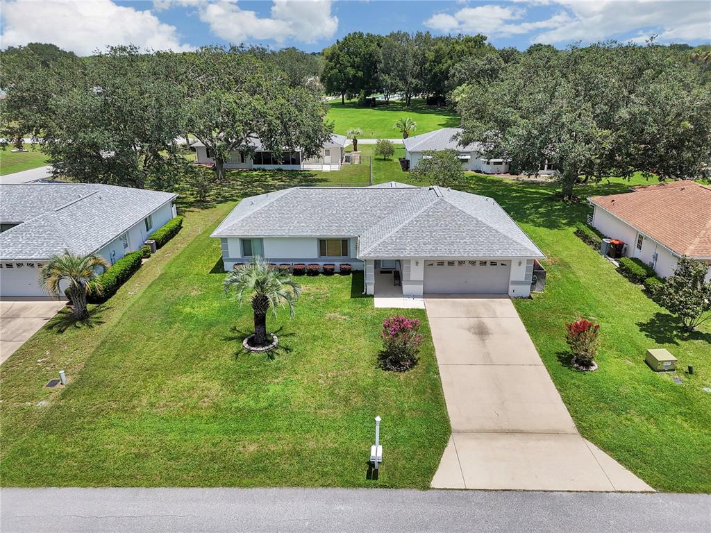 This is a floor plan showing a single-story house with a garage and sun room — 10237 SW 63RD AVENUE, OCALA, FL
