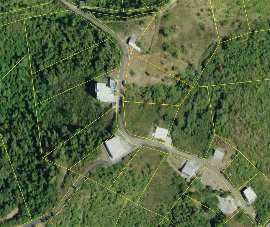 This is an aerial map showing a vacant lot outlined in orange — 154 CALLE BASTIMIENTO, VIEQUES, PR